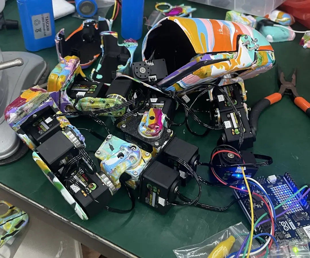 Huebot parts and painted shell on the workbench